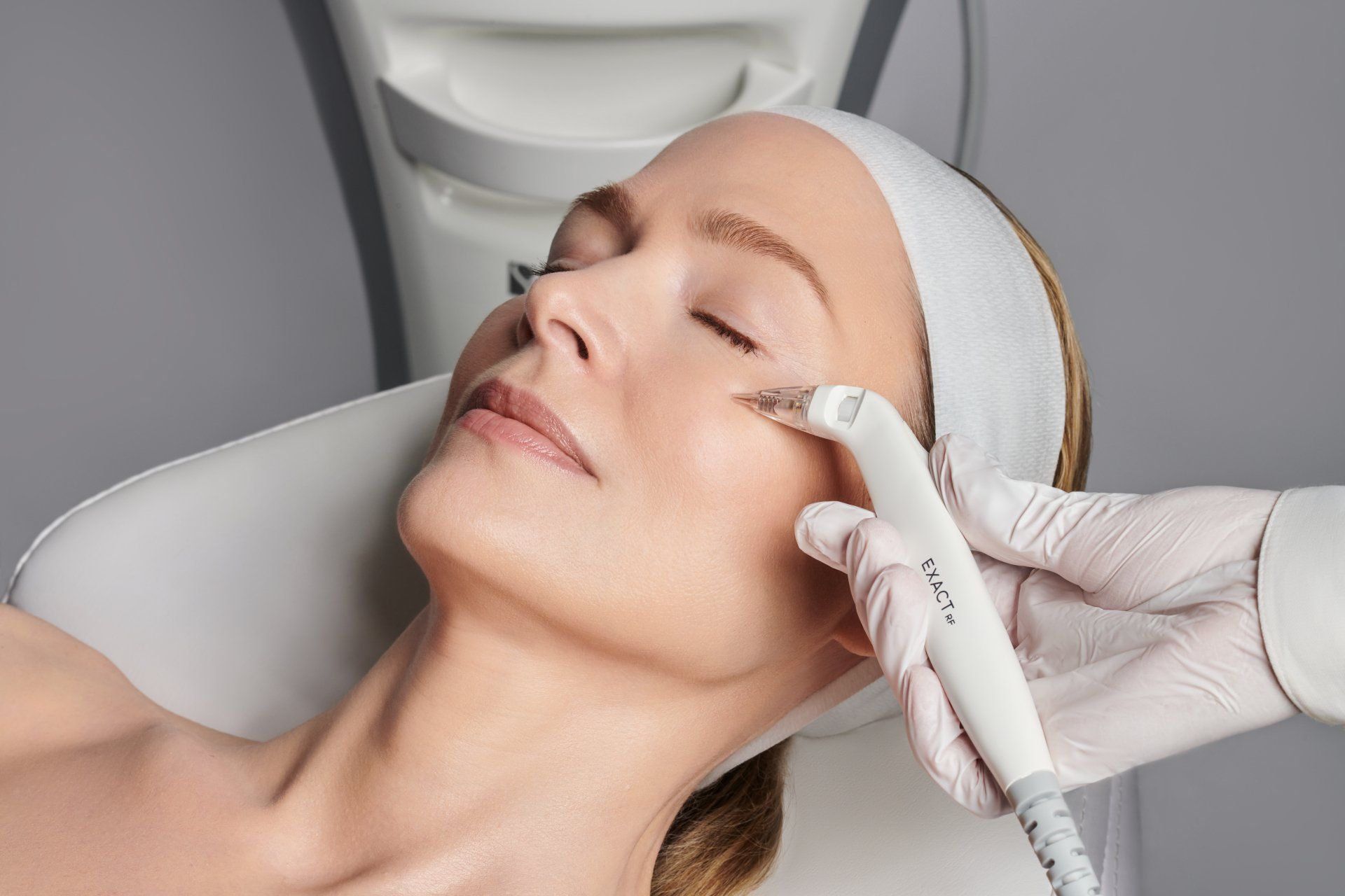 A woman is getting a facial treatment at a beauty salon.