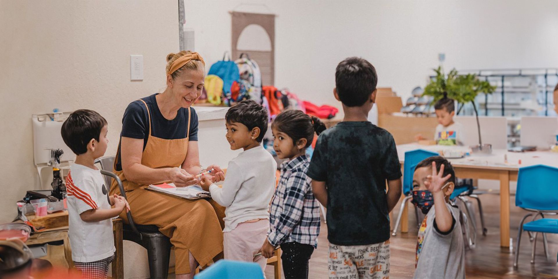 Students and guide in a Montessori classroom