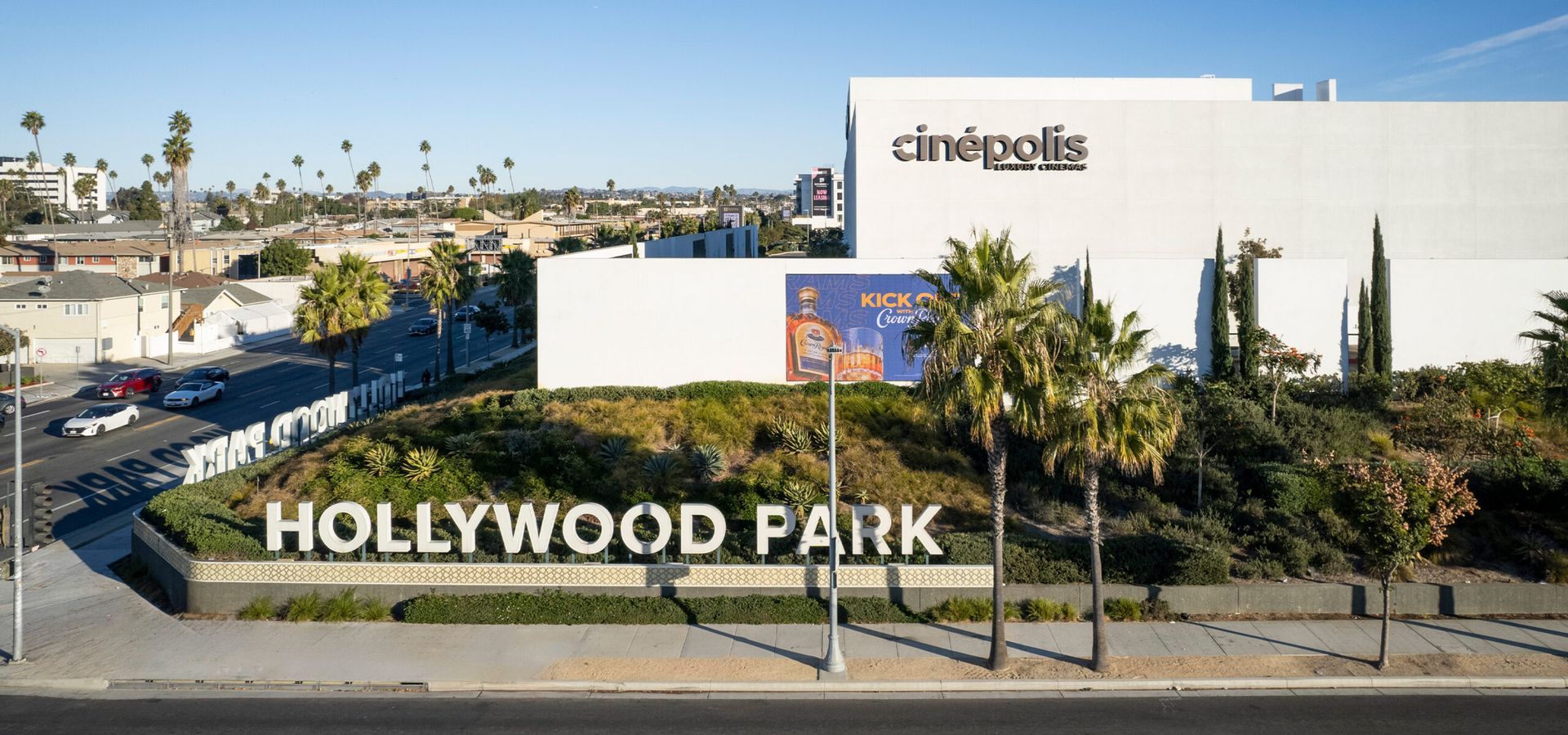 Building exterior with a grassy lawn and trees.