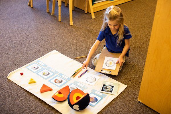 Child working on the Montessori great lessons