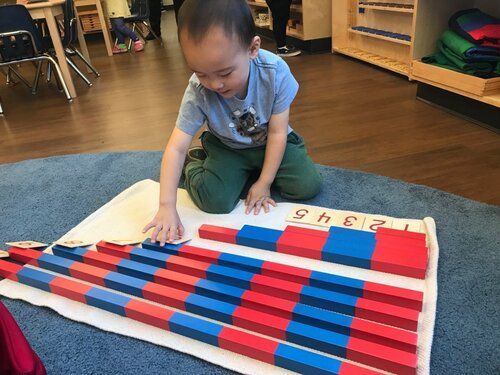 Child working with Montessori Math materials