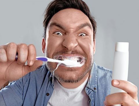 Man brushing teeth