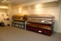 There are many different types of coffins in this room.
