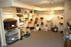 A room filled with a variety of urns and coffins.