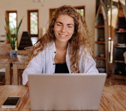 Happy woman at her computer