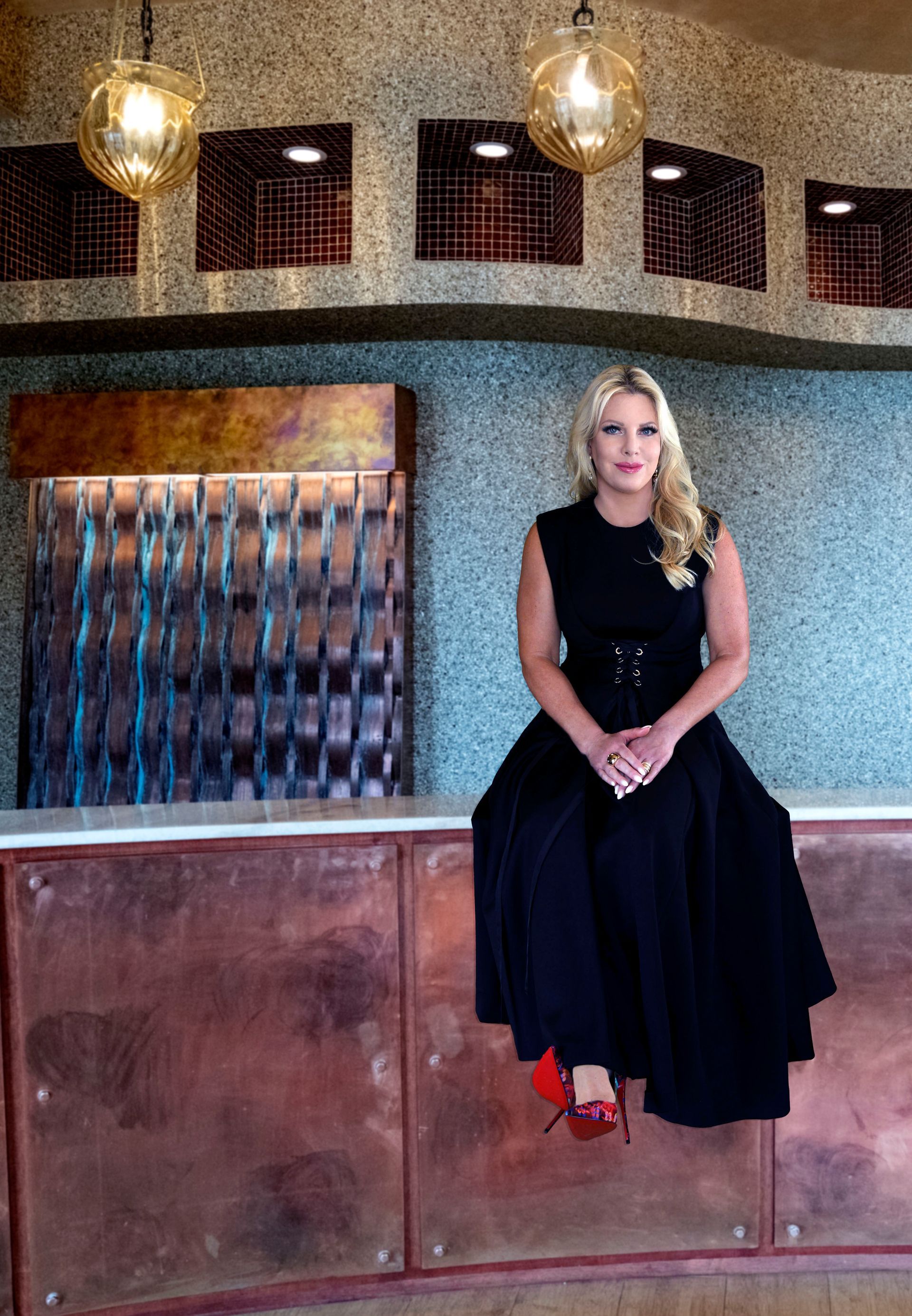 Three women are posing for a picture in a room.