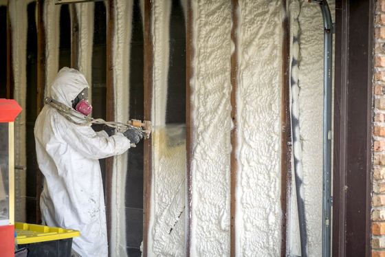 Image of a contractor insulating a garage with spray foam 