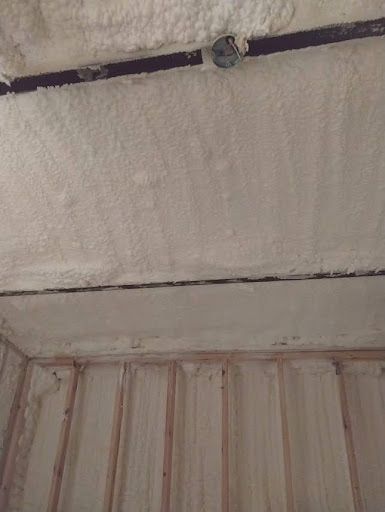 Image of spray foam insulation on a metal building.