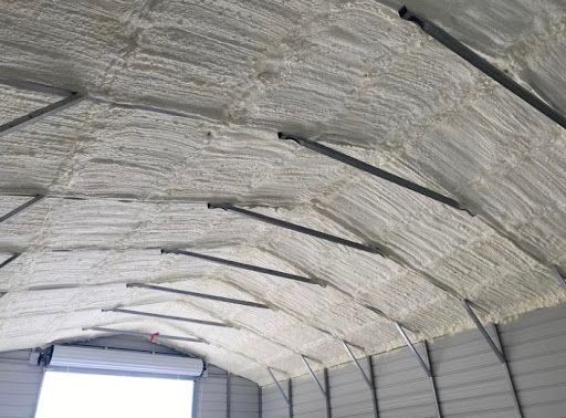 Image of a Sheds roof with newly applied spray foam insulation. 