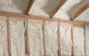 Picture of a wall getting spray foam. 
