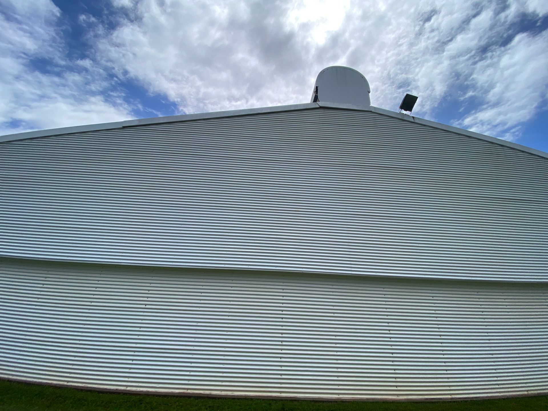A Person Spraying Foam on a Doorway With a Pressure Washer — Zac's Bin and Pressure Cleaning In Parramatta Park, QLD