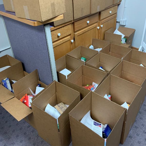 A bunch of cardboard boxes filled with various items