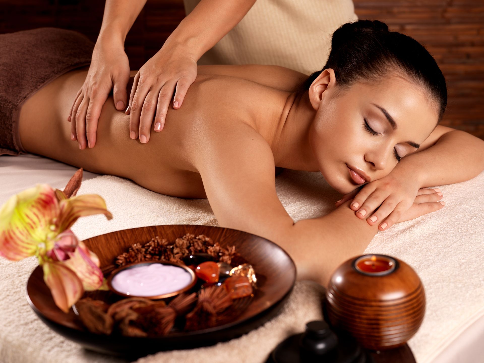 Woman Receiving Back Massage at A Spa — Pink Lily Beauty in Blacksmiths, NSW