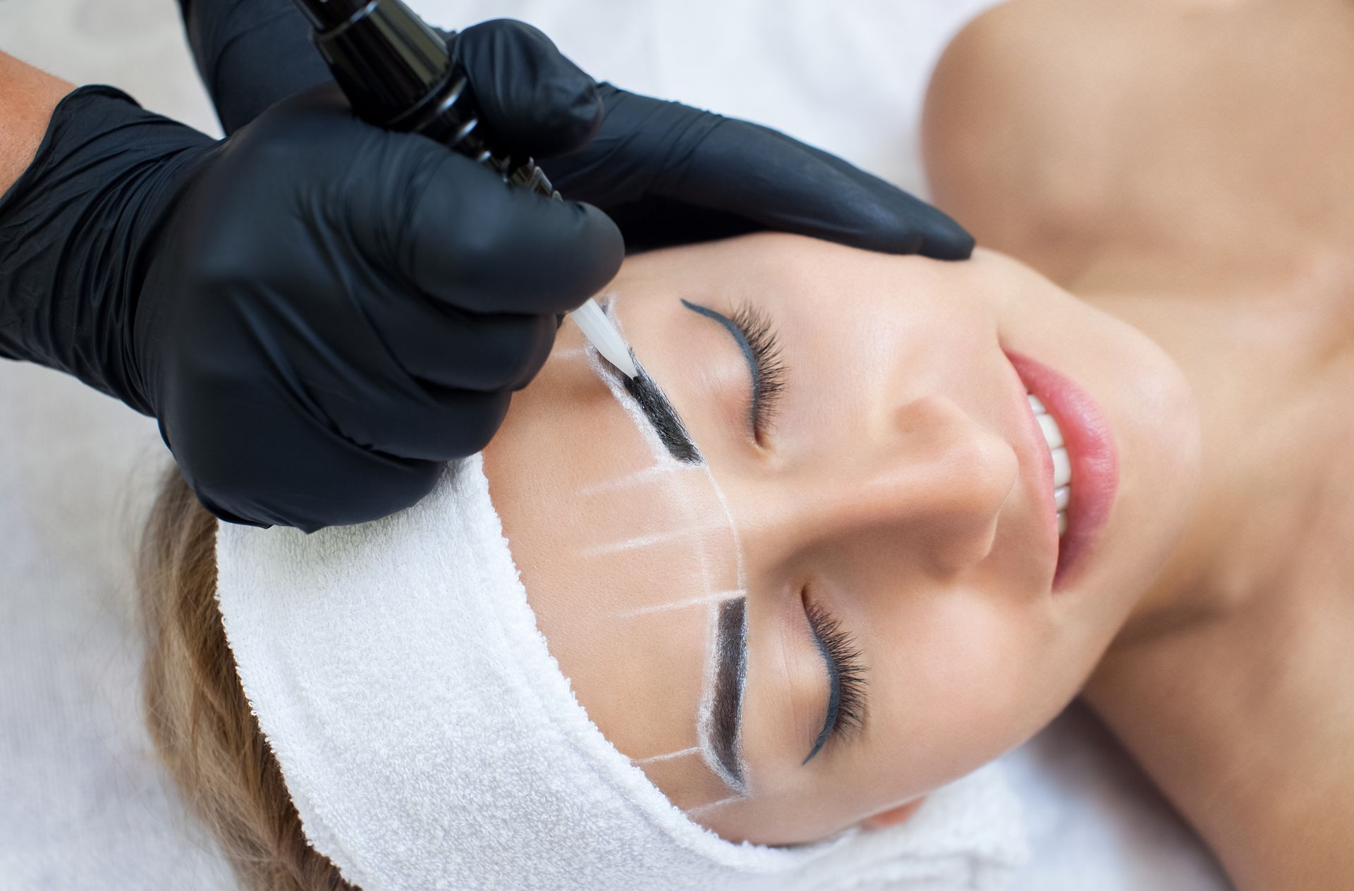 Person Getting Eyebrow Shaping and Tinting with Tool — Pink Lily Beauty in Blacksmiths, NSW