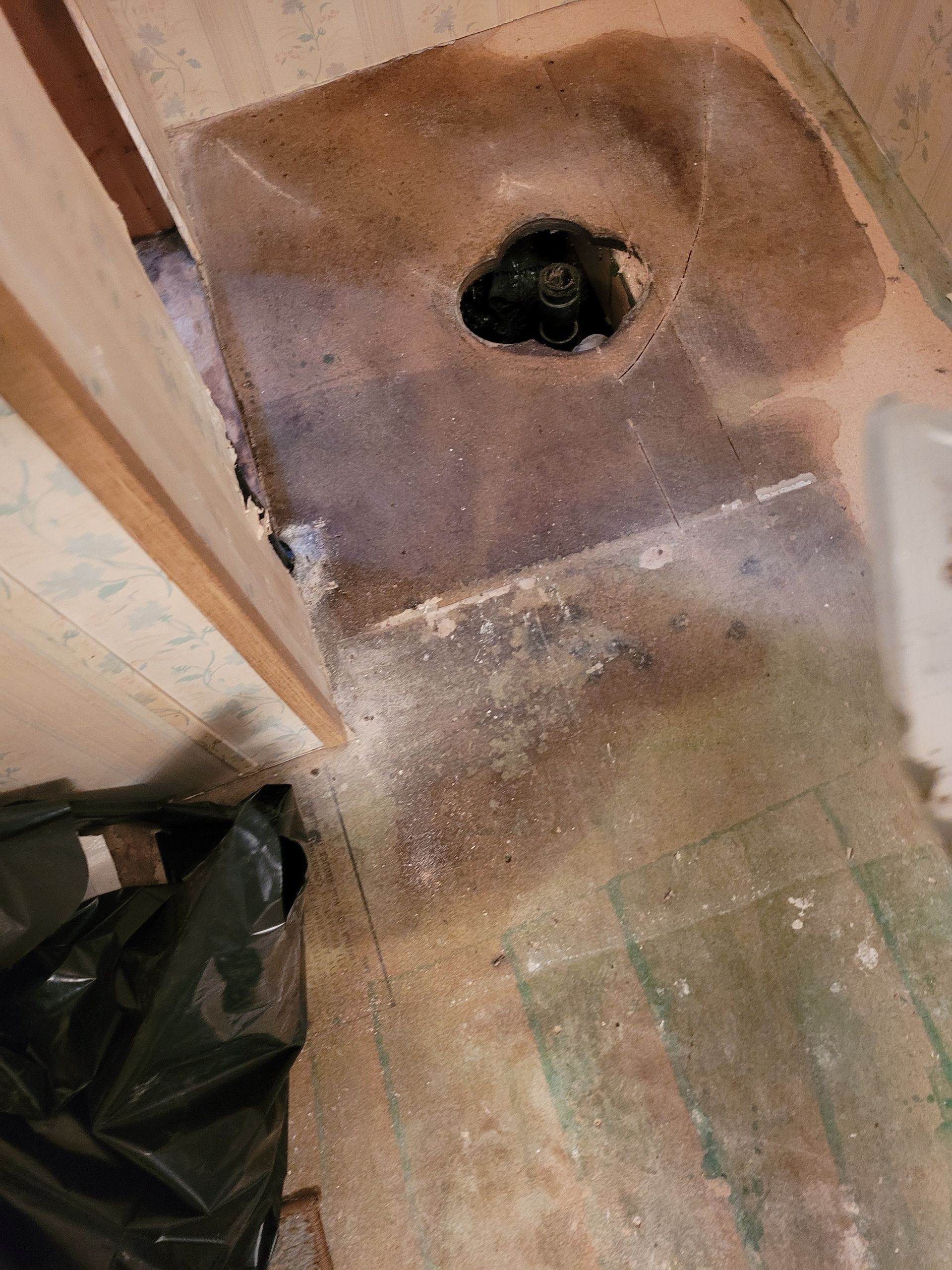 There is a hole in the floor in the middle of the room.