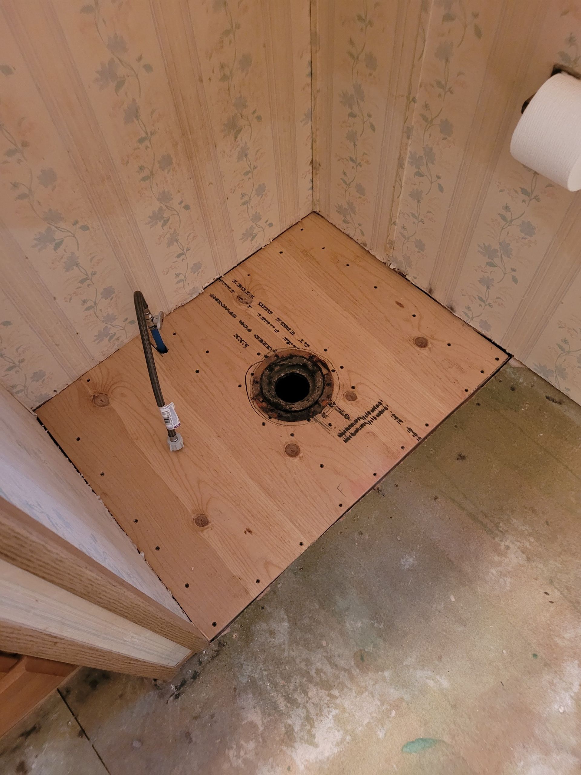 A wooden floor with a hole in the middle of it