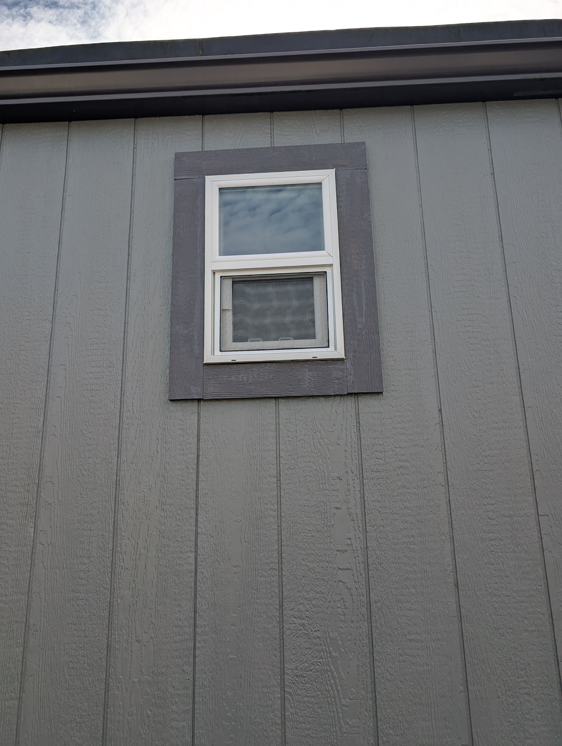 A small window on the side of a building