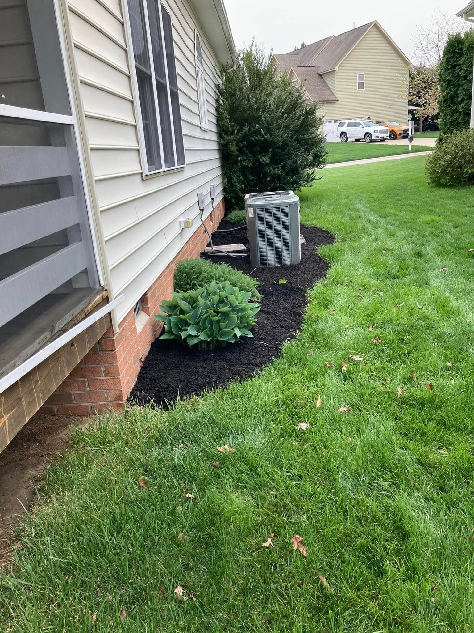 Exterior of house with landscaping, AC unit, and green grass.