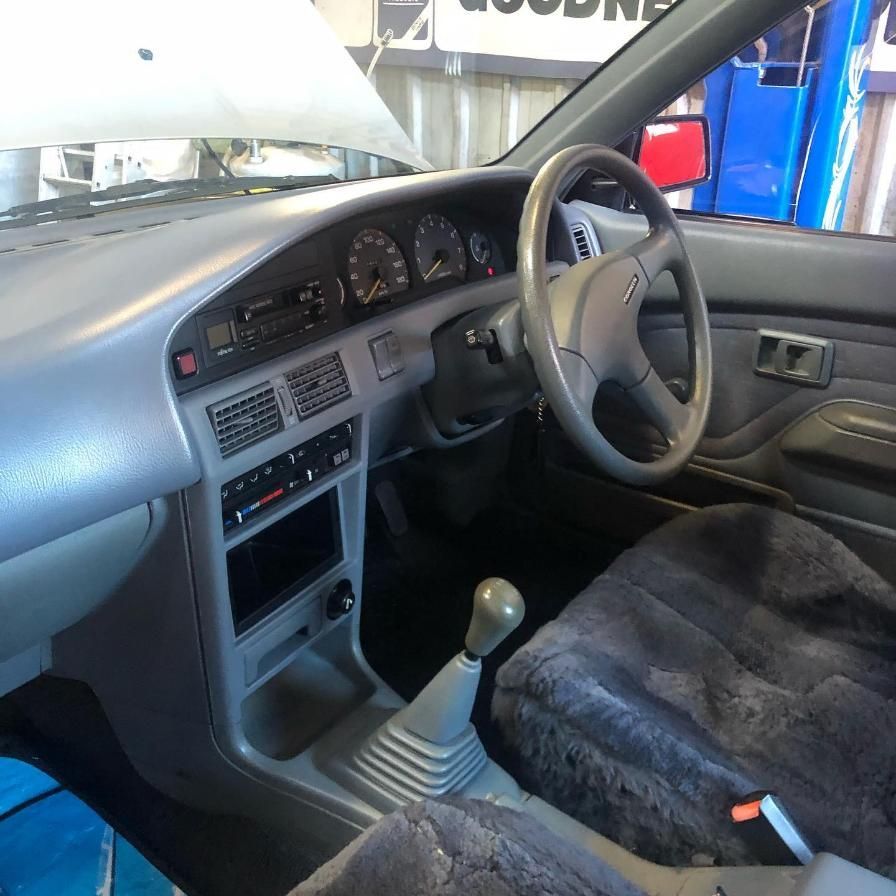 The Inside of a Car With a Steering Wheel and Dashboard — Coastal Automotive Services Long Jetty in Bateau Bay, NSW