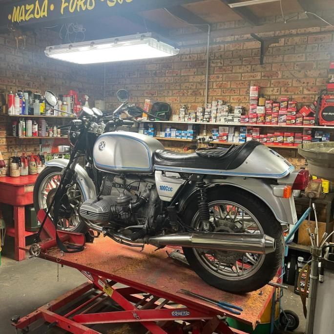 A Motorcycle is Sitting on a Lift in a Garage — Coastal Automotive Services Long Jetty in The Entrance, NSW