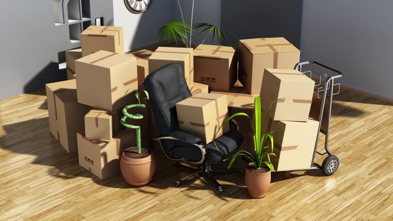 Office chair surrounded by packed moving boxes