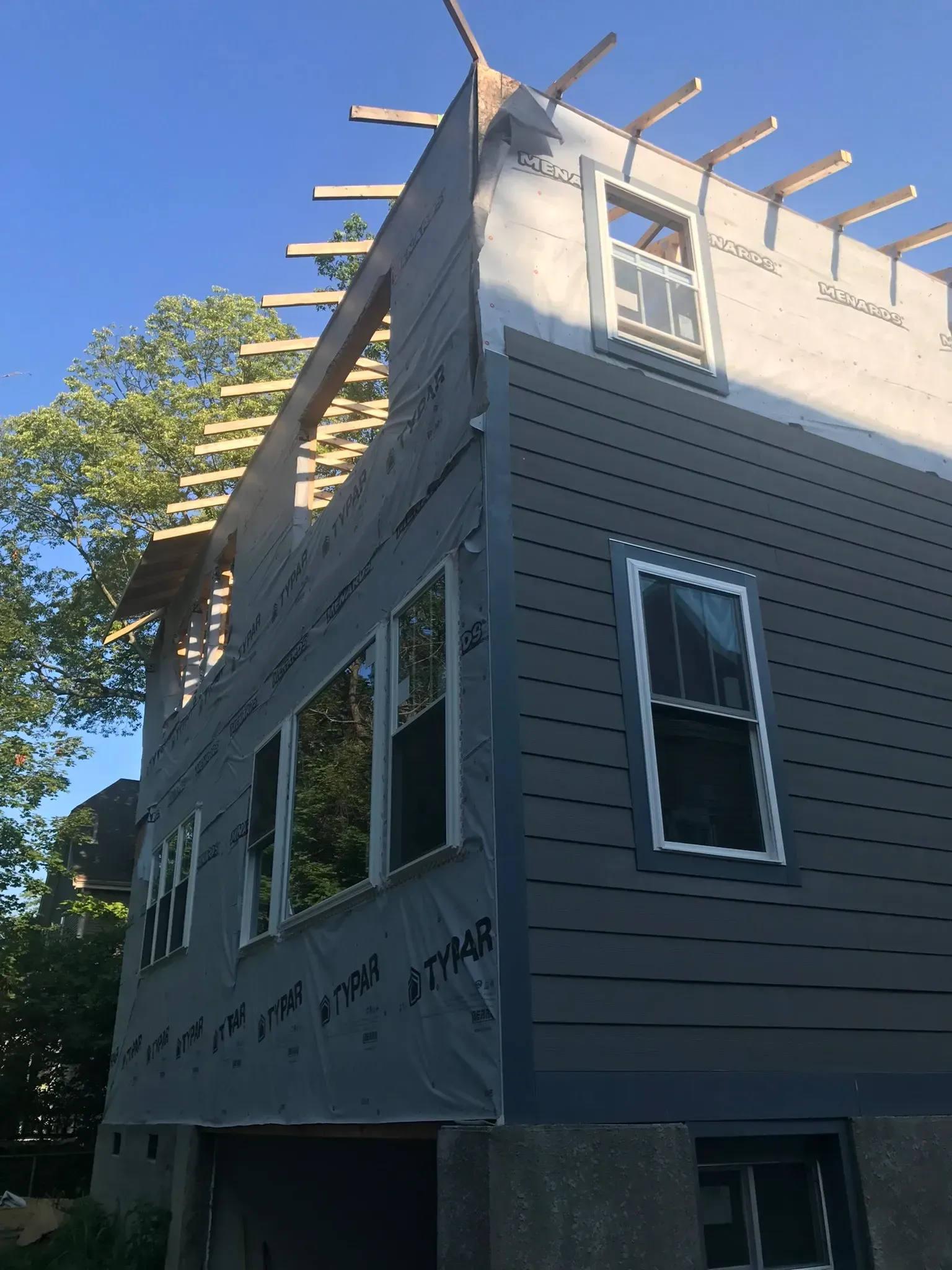 A house is being built with a lot of windows.
