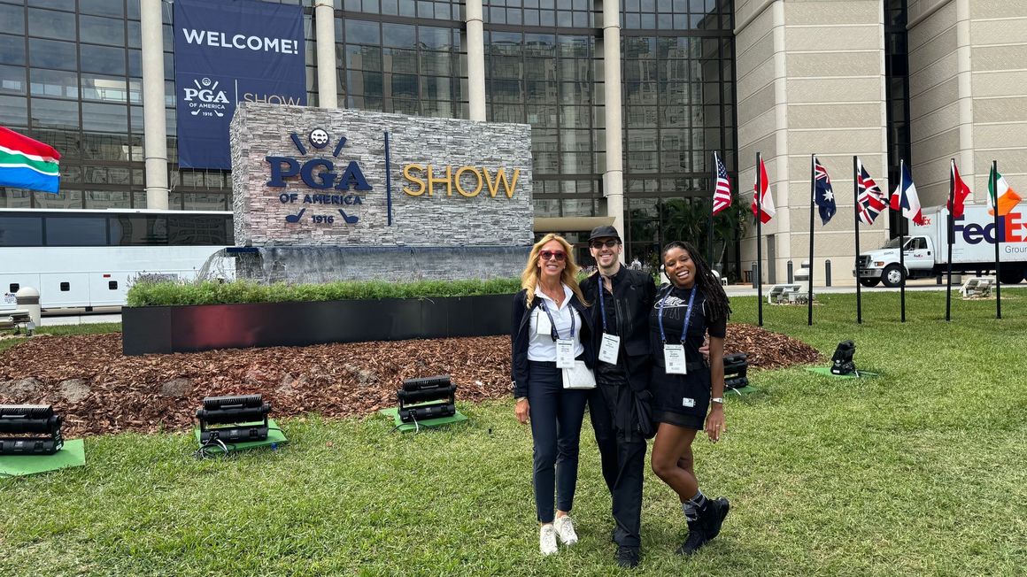 A group of people are standing in front of a building.
