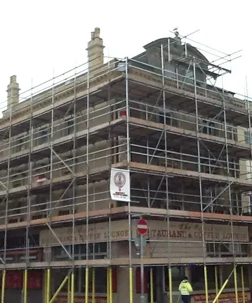 A large building with scaffolding on the side of it