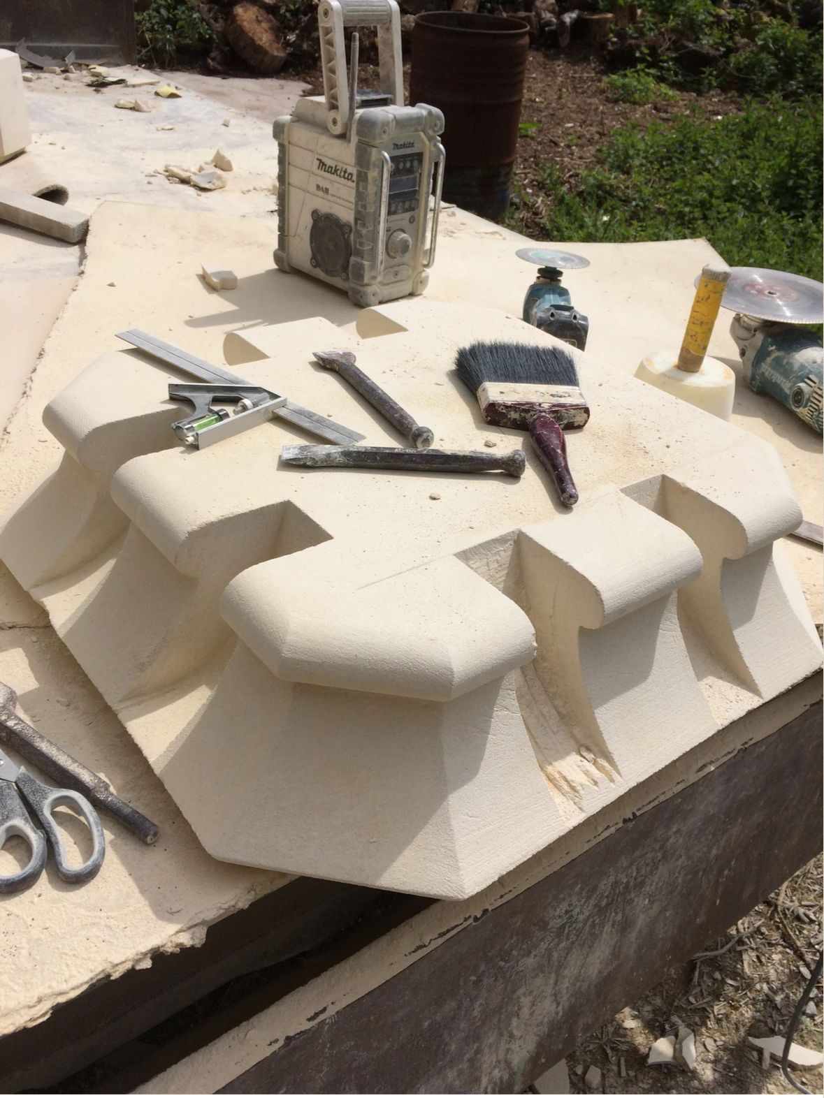 A table with a clock and tools on it