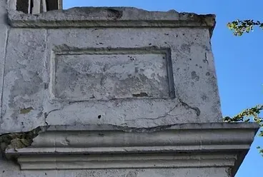 A very old building with a blue sky in the background