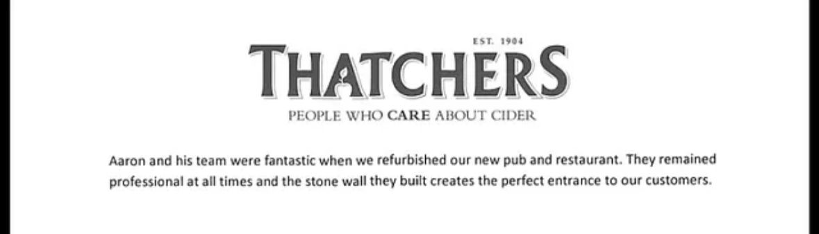 A white sign that says thatchers on it