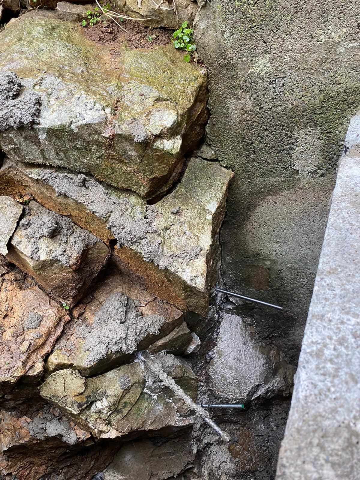 A pile of rocks sitting on top of each other on a concrete surface.