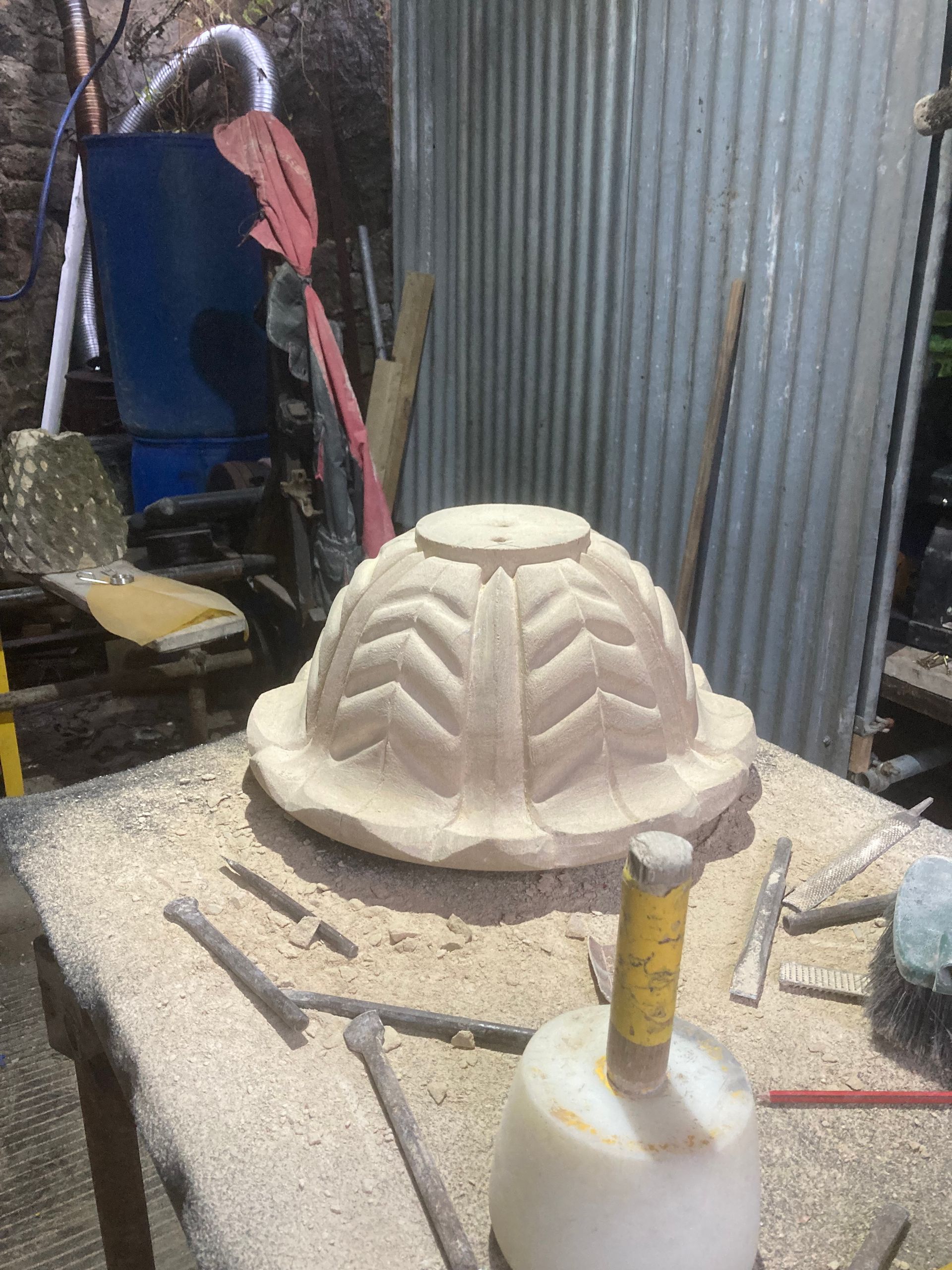 A piece of wood is sitting on top of a wooden table.