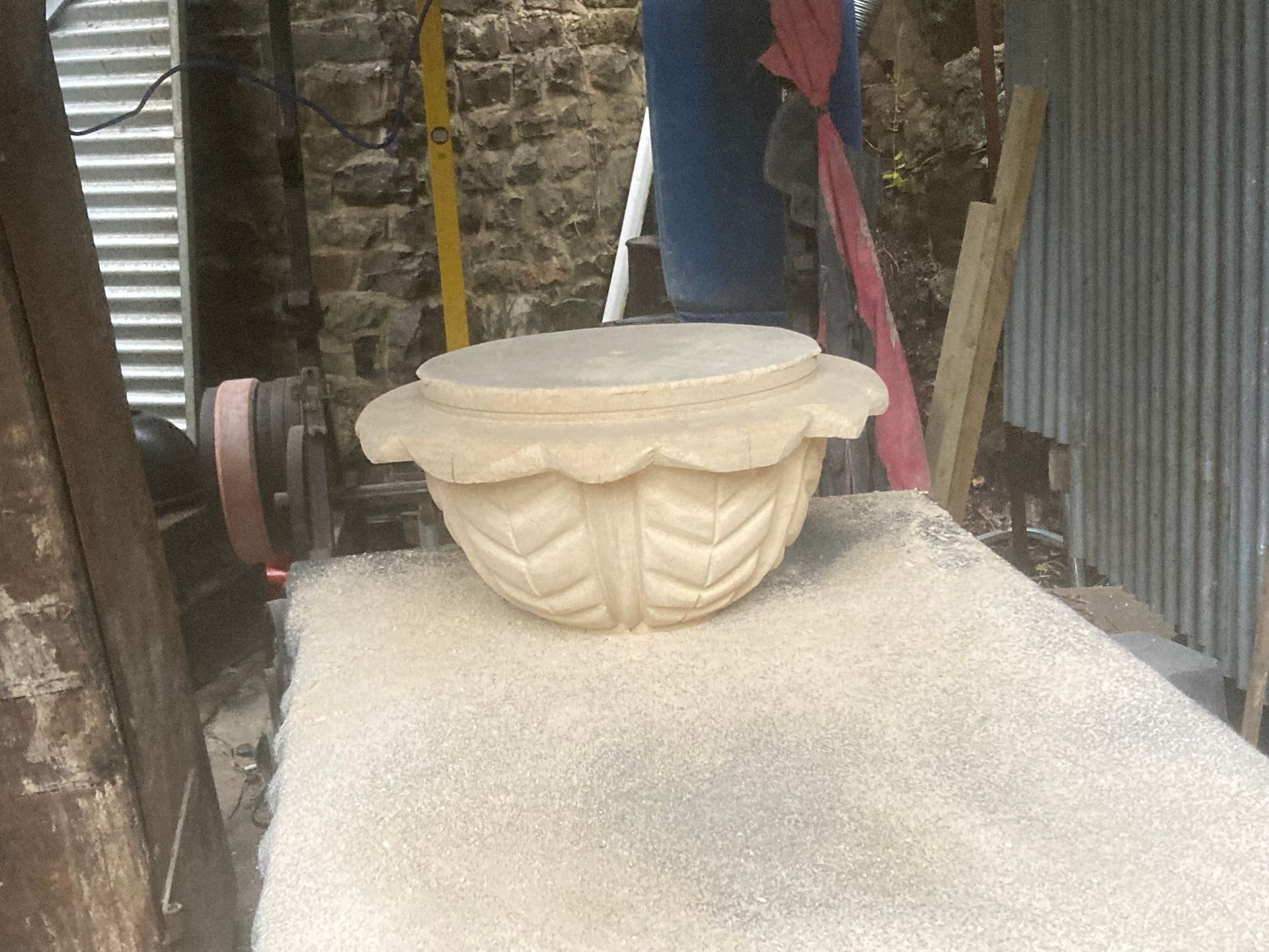 A large white bowl is sitting on top of a table.