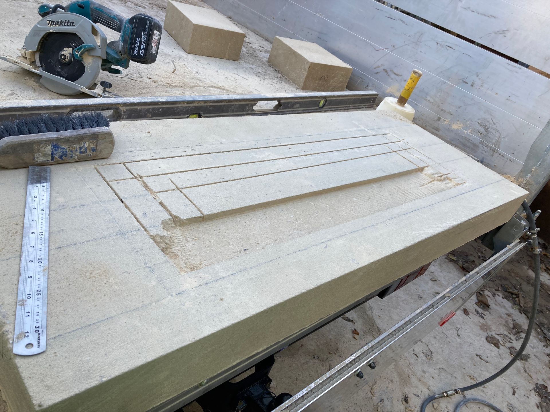 A circular saw is being used to cut a piece of wood