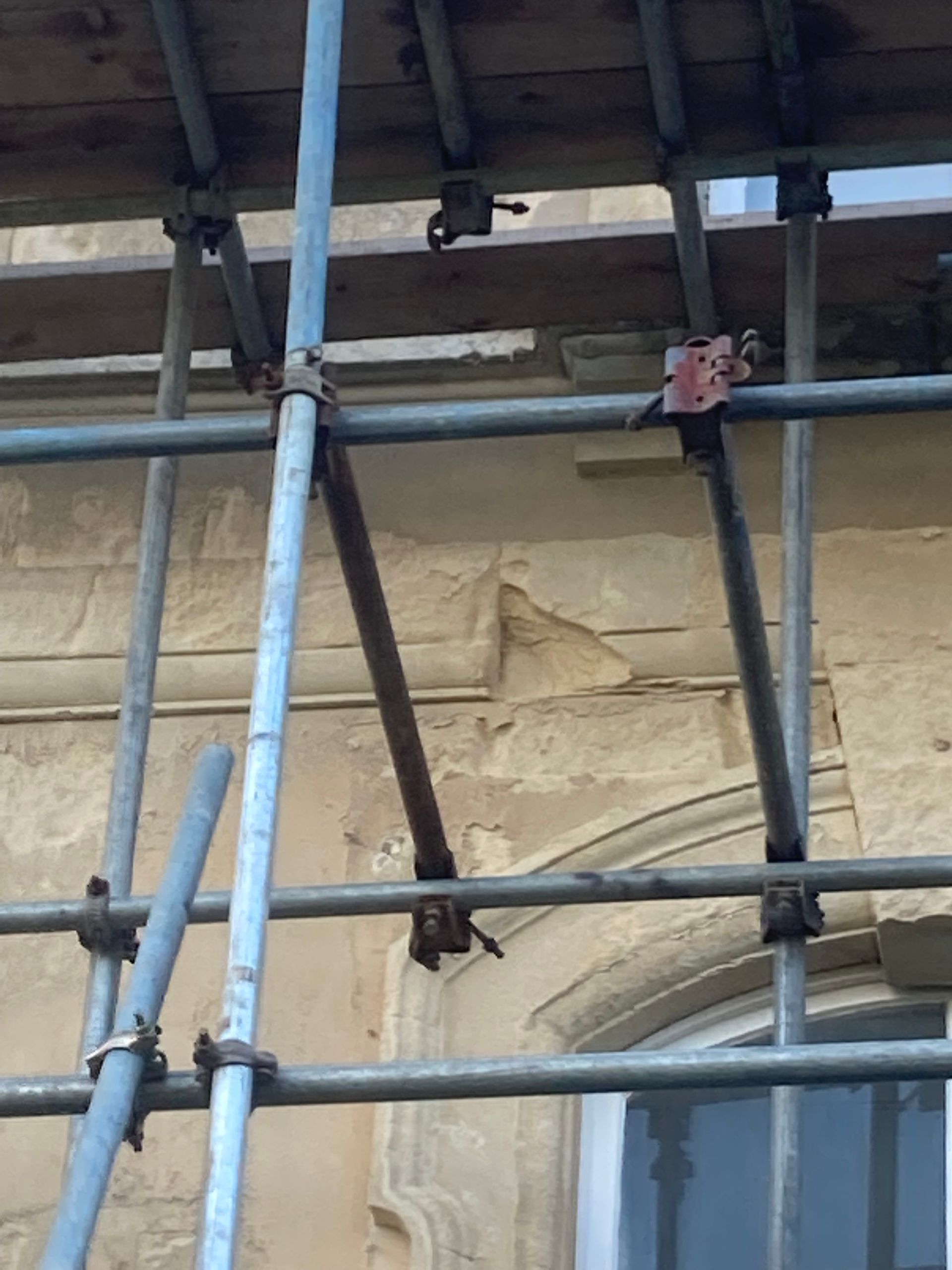 A close up of a scaffolding in front of a building
