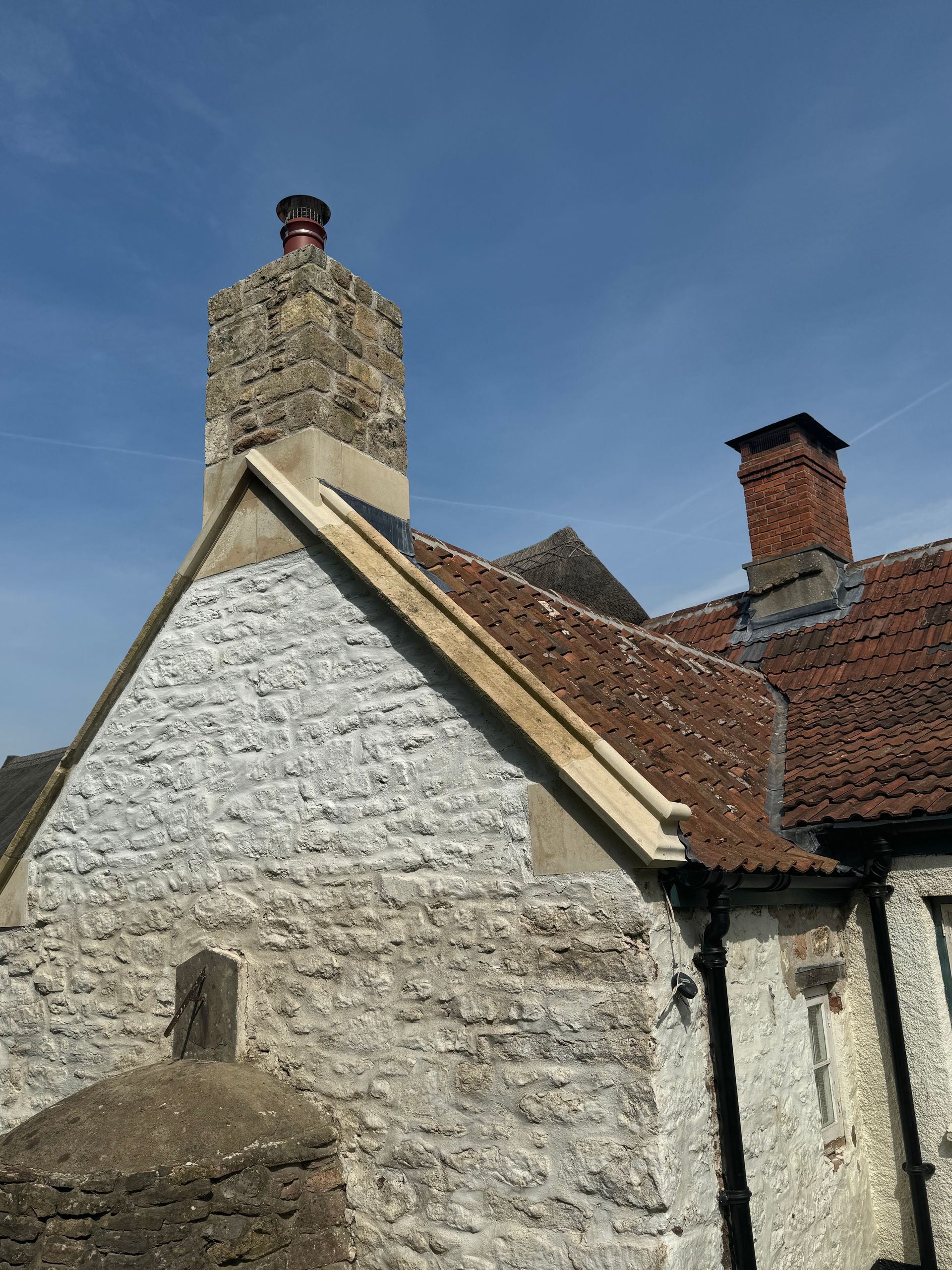 A brick building with a chimney on top of it