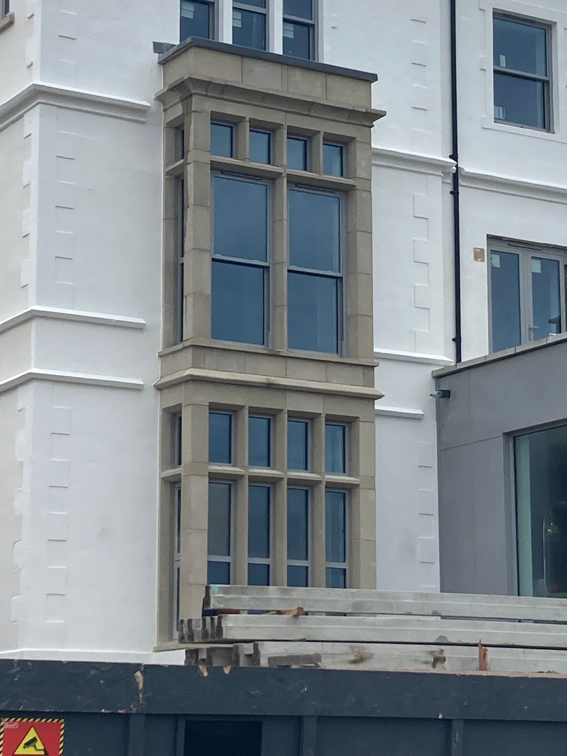 A large white building with a lot of windows