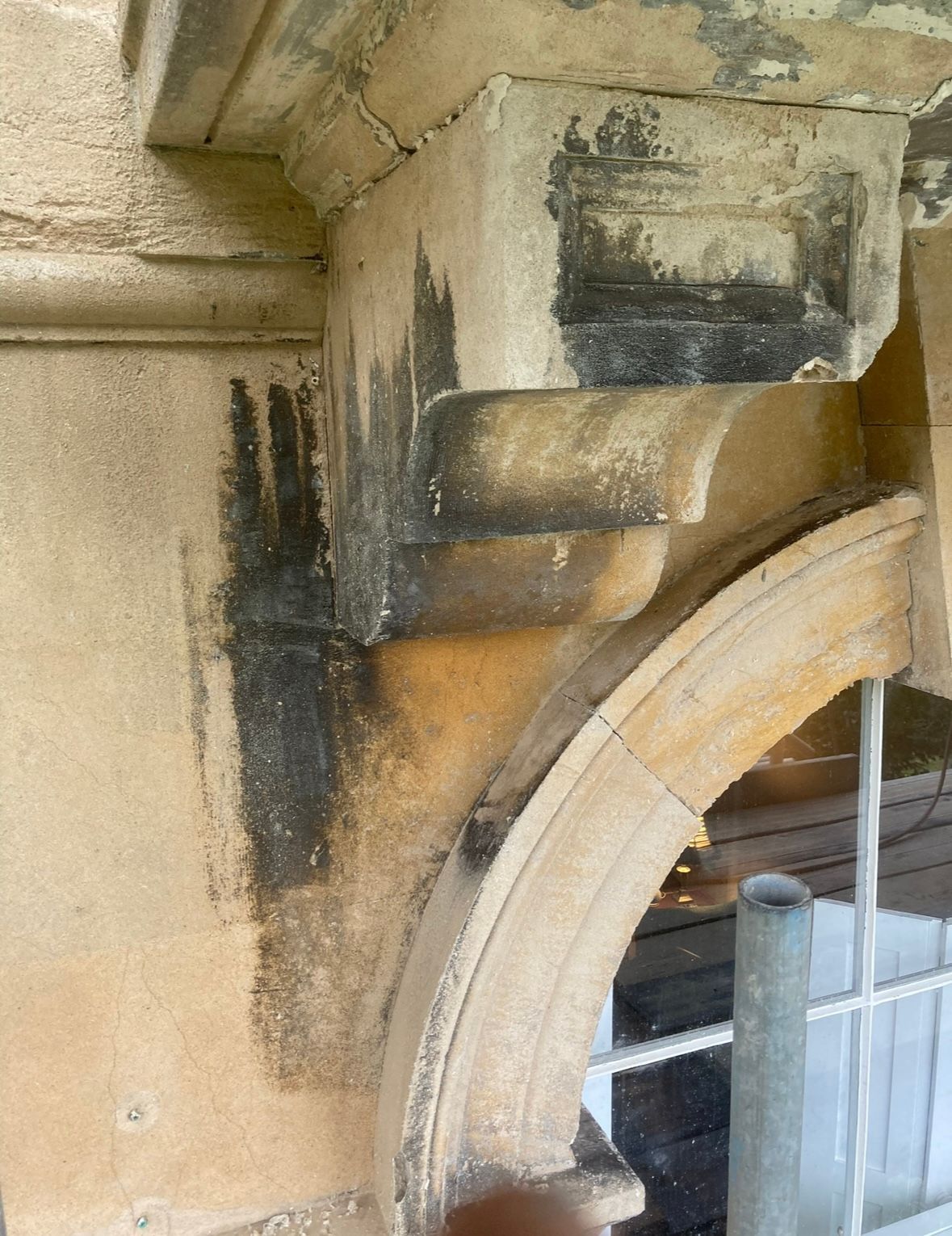 A close up of a stone archway on a building