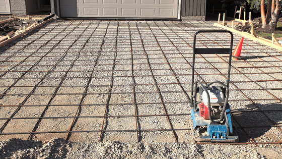 an image of preparation for concrete driveway pouring.