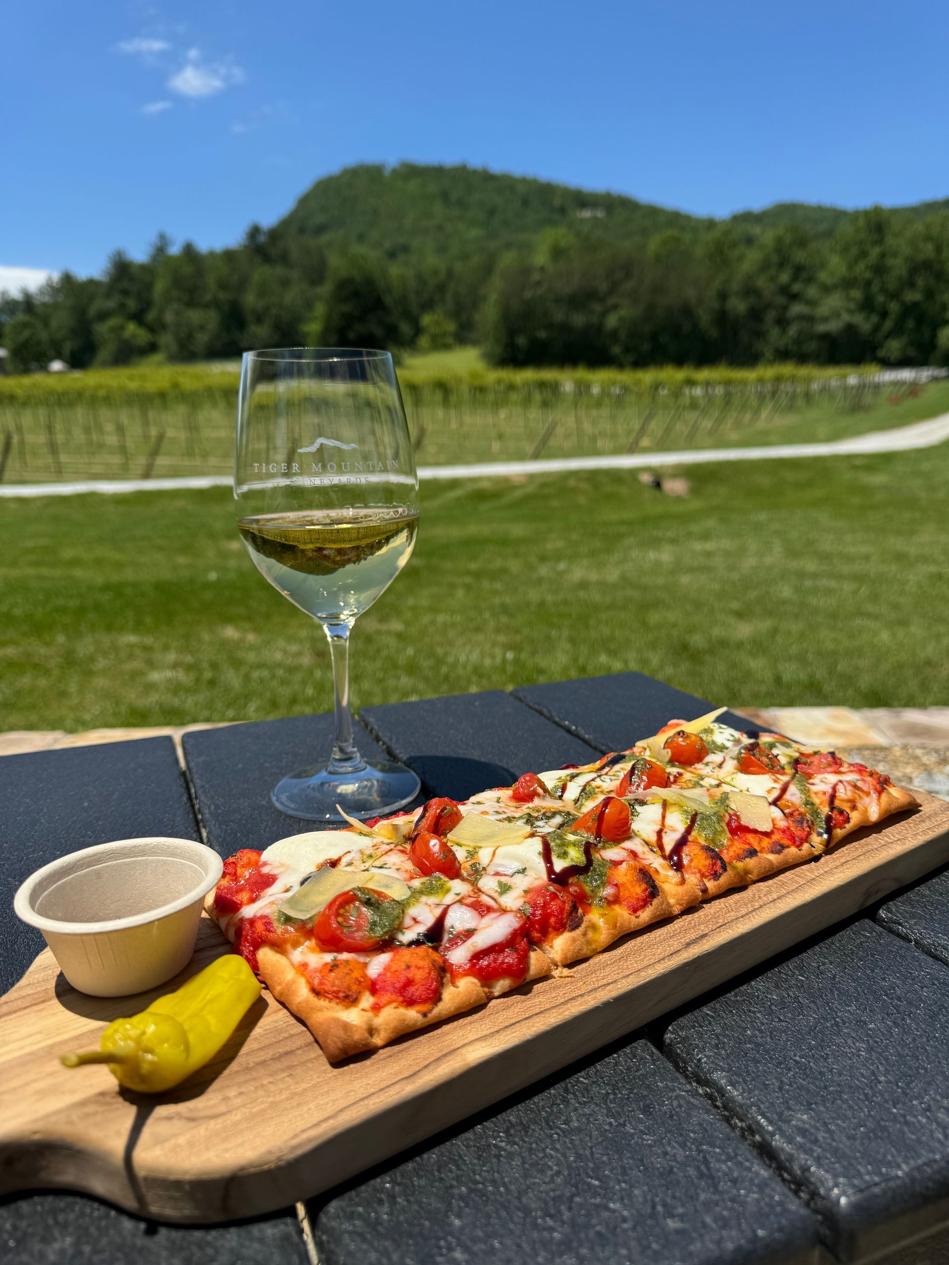 A red barn with a white umbrella in front of it