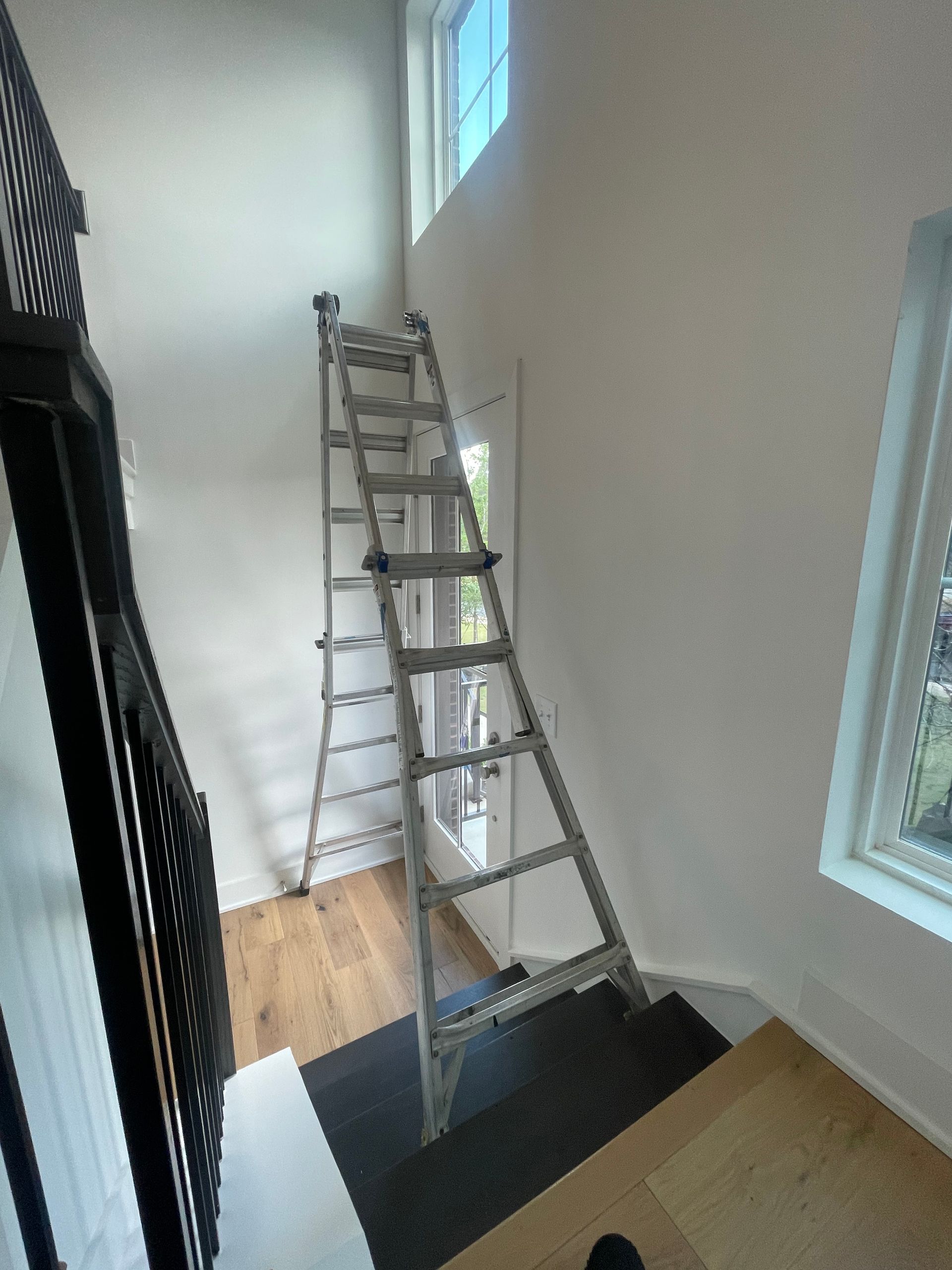 A ladder is leaning against a wall in a room.