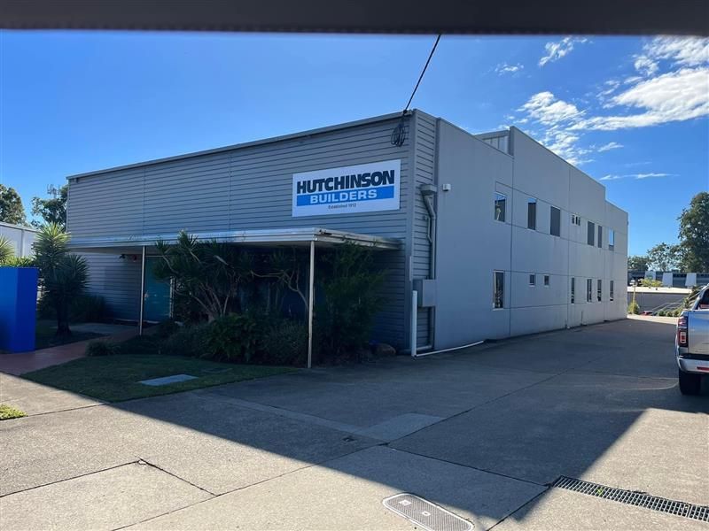 A white building with a sign that says hutchinson on it