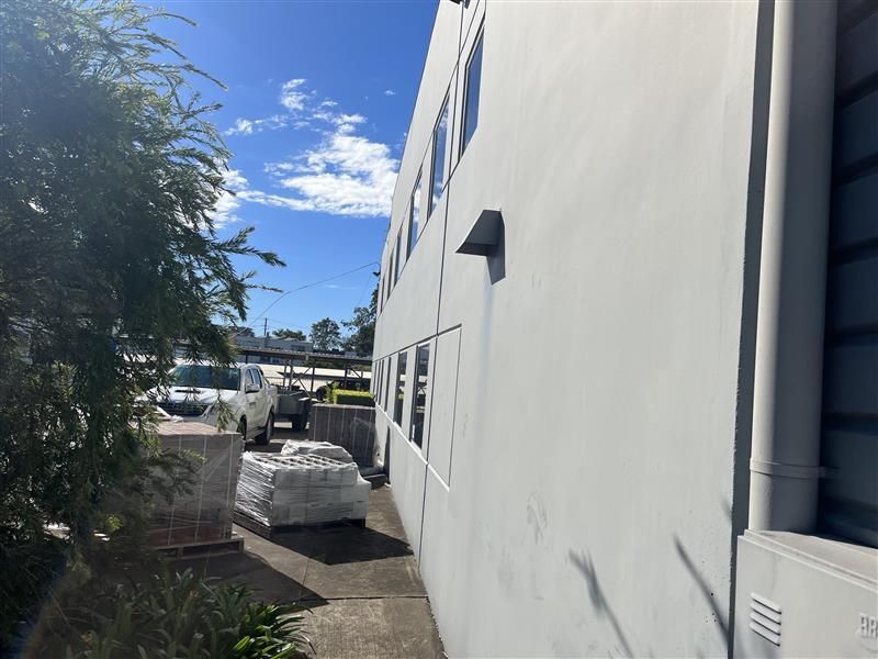 A white building with a lot of windows on a sunny day
