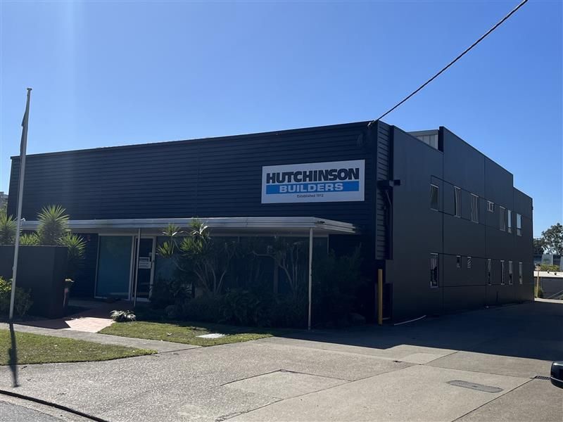 A large black building with a sign that says hutchinson building co.