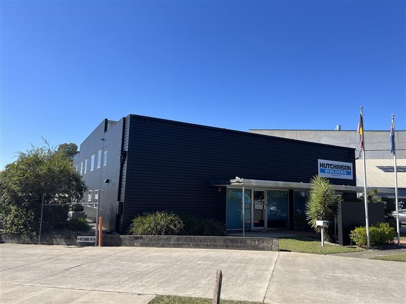 A large building with a blue sky in the background