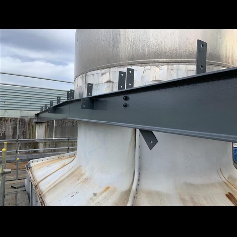 A close up of a metal structure on top of a building.