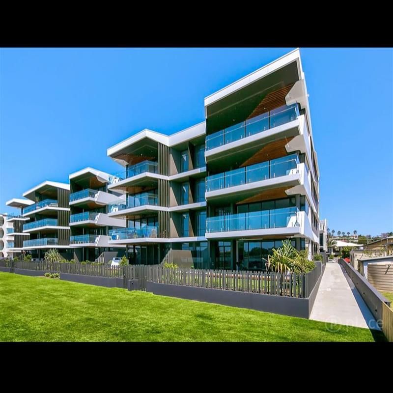 A large building with a lot of windows and balconies