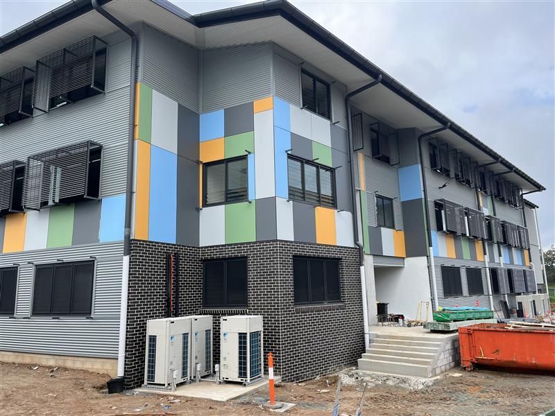 A large building with a lot of windows is being built.
