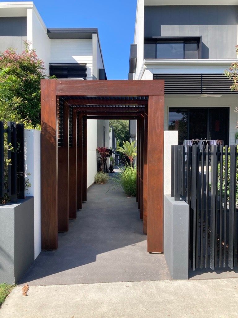 A house with a wooden walkway leading to it